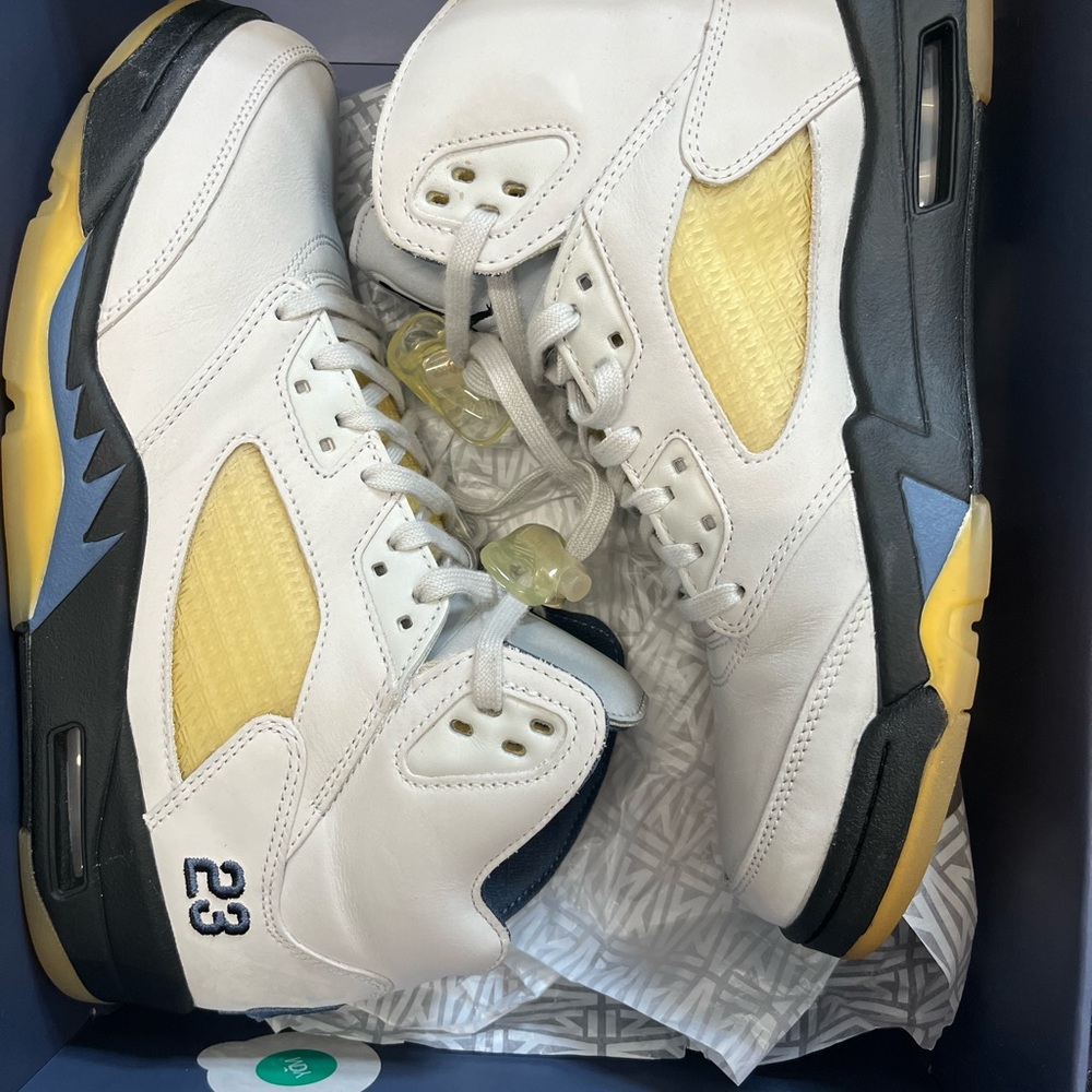 Jordan White and Yellow Athletic Shoes with Modern Silhouette